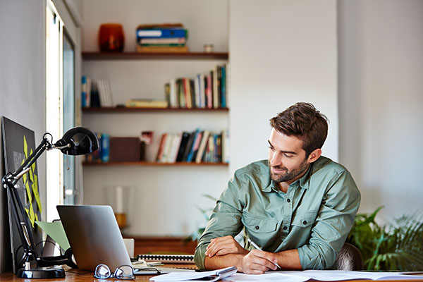 Man sat at a home office desk